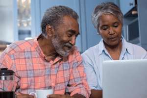 couple using laptop