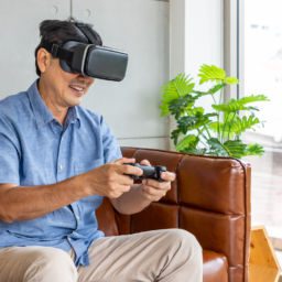 Senior man playing virtual reality game