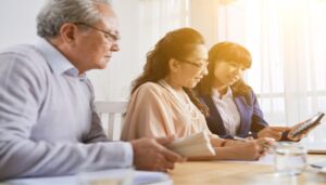 movement disorders center a trio of people at a table