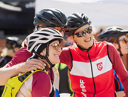 Cyclists taking a group photo after a race